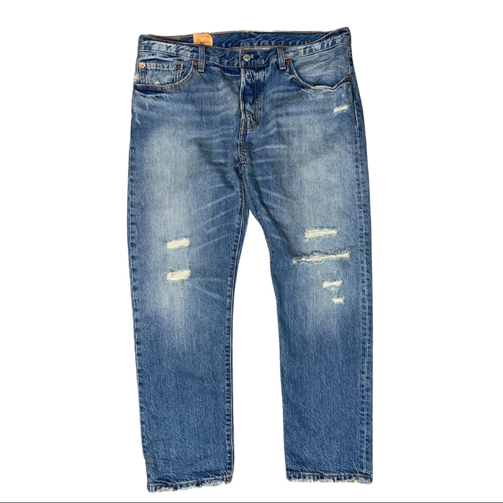 Levi 501ct Distressed Tapered Leg with Button Fly. Size: 31W 32L